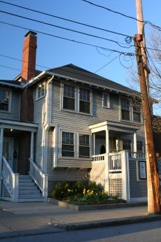 House, with garden.  Poles on right need pole transfer.  Either Brighton or West Roxbury, April 15 2008, Massachusetts 