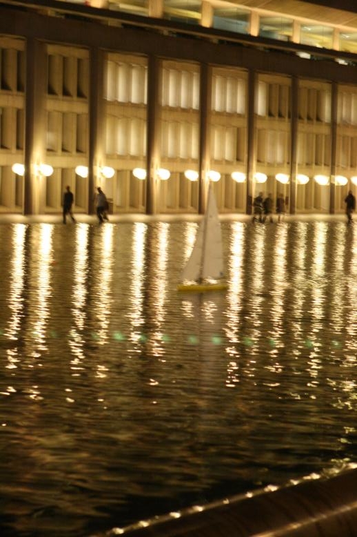 radio controled model sailboat in reflecting pool, nighttime, Christian Science Church, Boston, Massachusetts.