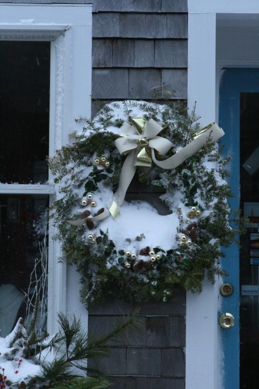Holiday Wreath covered with an iceing of snow.  Jan 3, 2009.