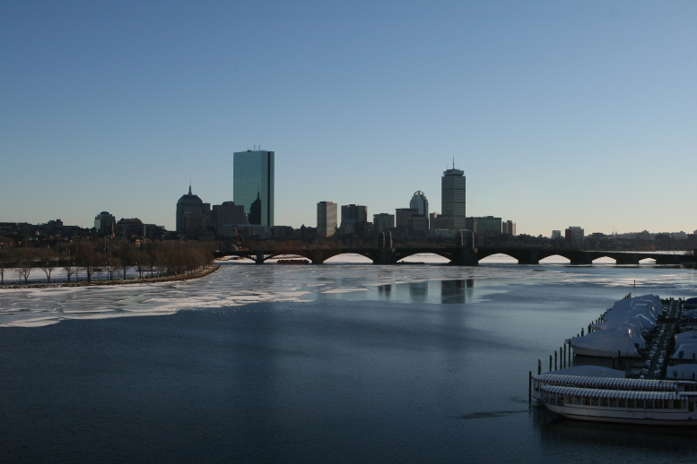 View of Boston and Cambridge and the river in between them. Major buildings and the bridge are in the scene. This was a Winter day. The River is partly frozen. copyright © 2011. 